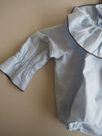 Marco's romper in Celeste